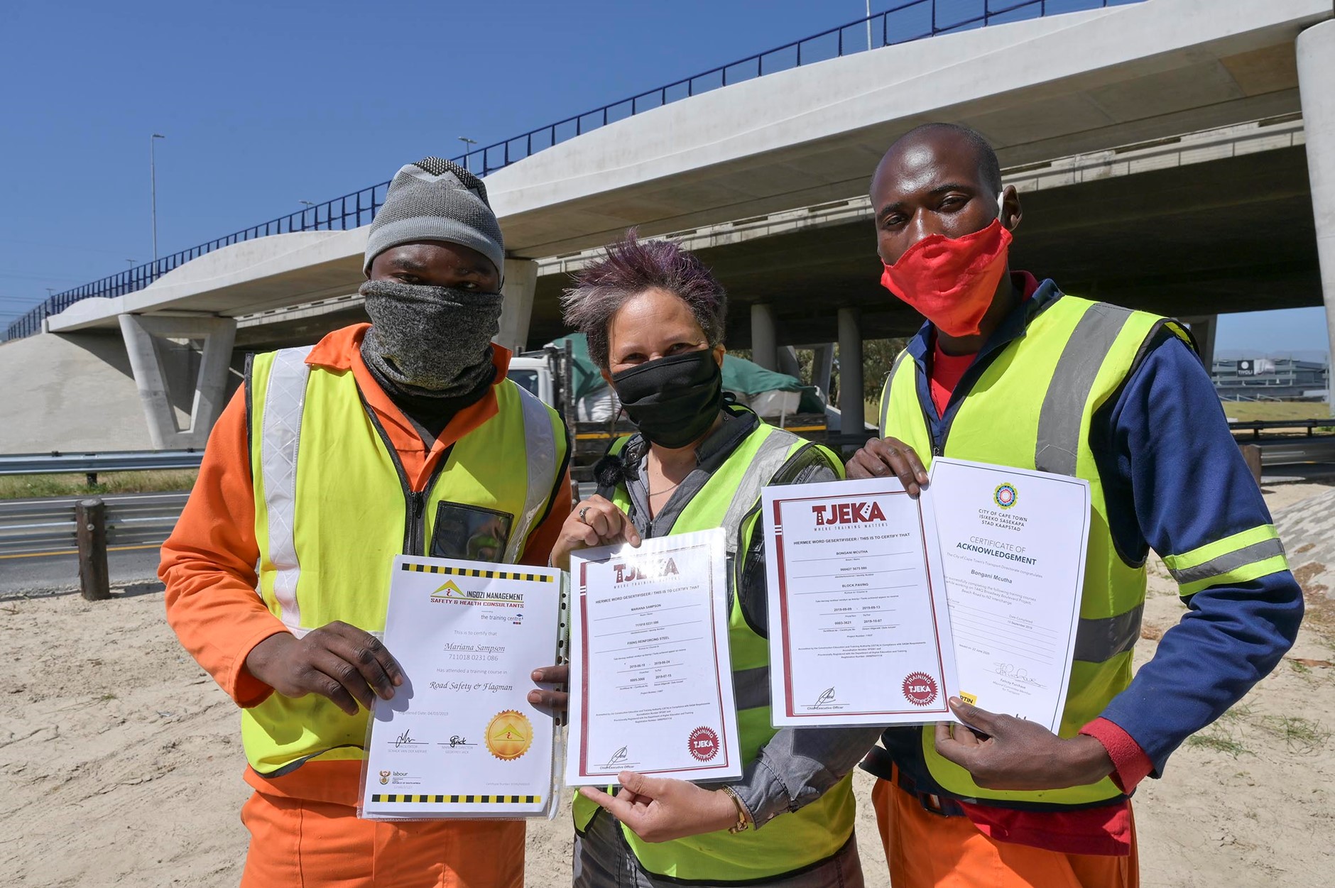 Figure 14: Proud employees displaying their skills development accreditation (Photo Credit Bruce Sutherland)